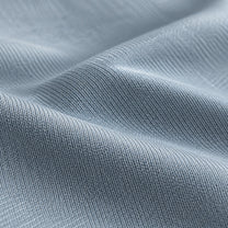 Close-up of the pale grey cooling knit and its silky sheen