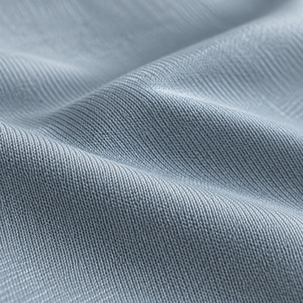 Close-up of the pale grey cooling knit and its silky sheen