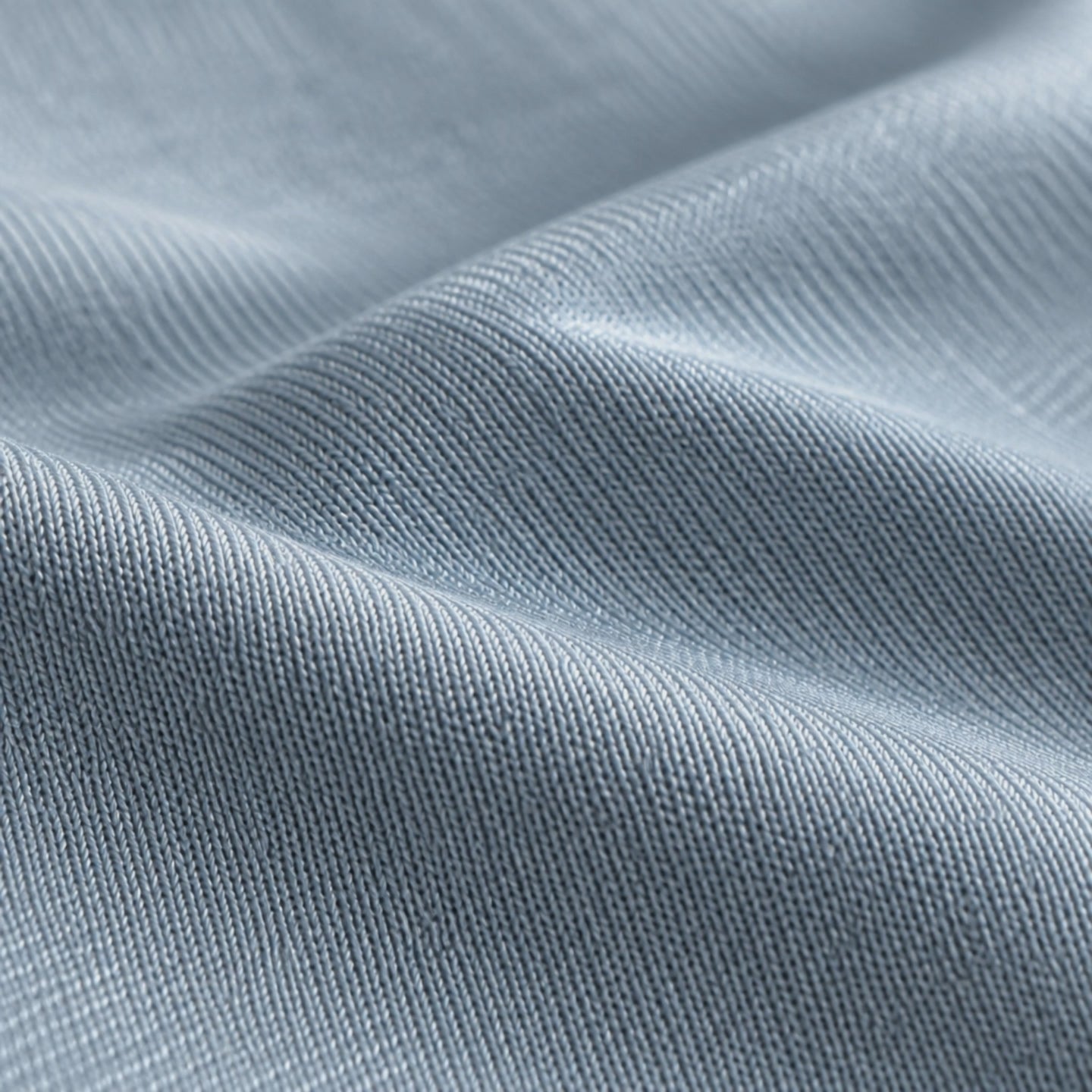 Close-up of the pale grey cooling knit and its silky sheen